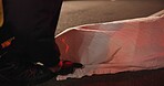 Crime scene, dead body and cover for accident at night in road, street or outdoor with paramedic or 911. Death, first responder and woman murder, violence or homicide with law enforcement or medic