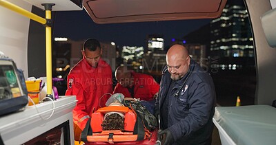 Ambulance, first aid and accident with a paramedic team on scene to rescue a person at night. Healthcare, medical and emergency with emt services on the street for urgent or professional medicare