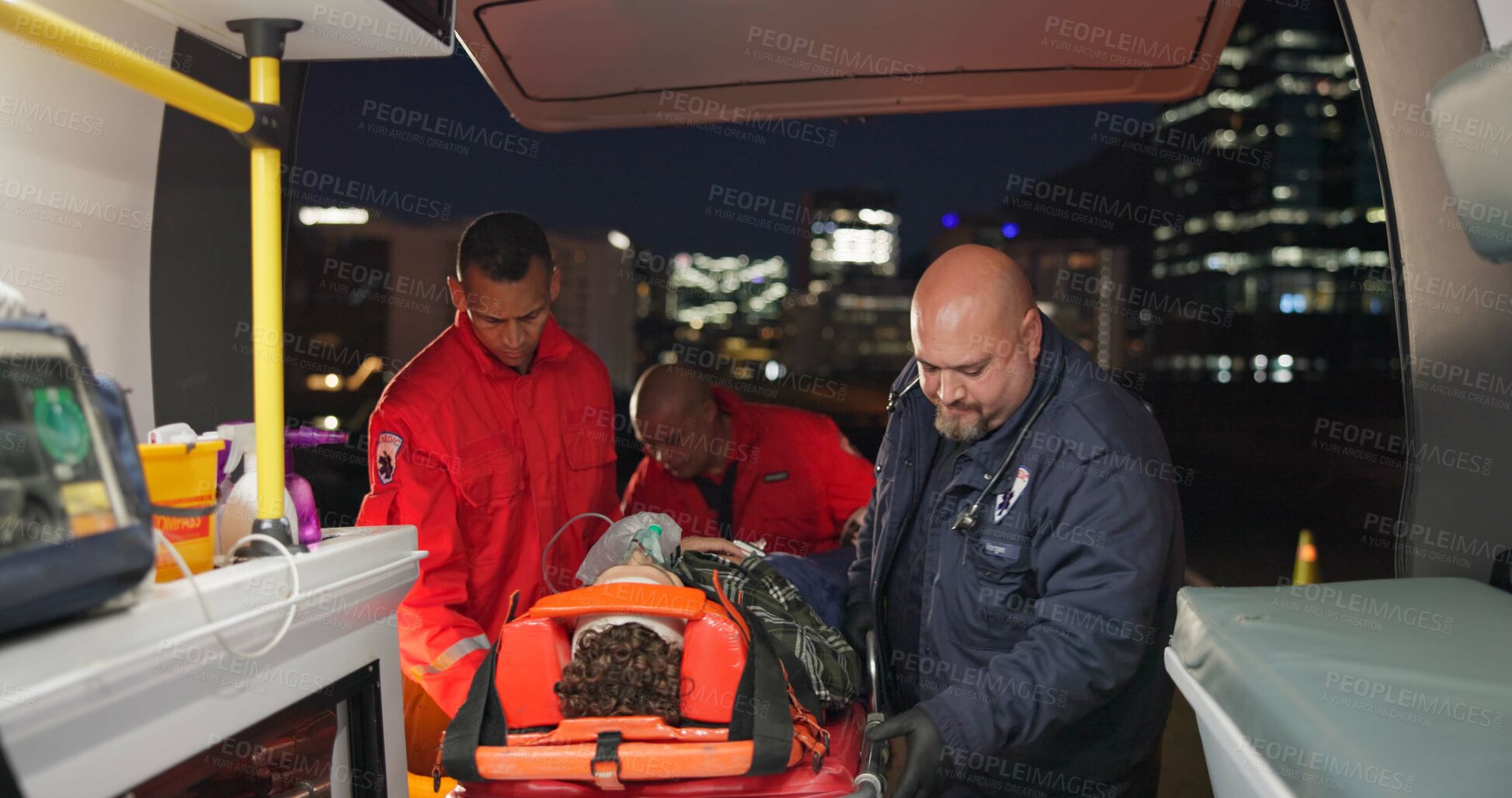 Buy stock photo Ambulance, first aid and accident with a paramedic team on scene to rescue a person at night. Healthcare, medical and emergency with emt services on the street for urgent or professional medicare