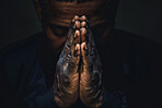 Hands, praying and man with worship for religion by black background with faith, guidance and gratitude. Christian, blessing and person with spiritual, trust or hope for belief and growth with prayer