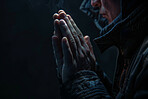 Hands, spiritual and person praying for religion by black background with faith, guidance and gratitude. Christian, blessing and model with hope, trust or worship for belief and growth with prayer.