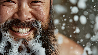 Portait, skincare and soap with asian man in bathroom closeup for cleaning, hydration or hygiene. Beauty, water in shower and smile with happy person washing beard or face for morning cleanse routine