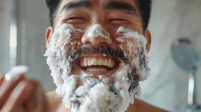 Buy stock photo Face, skincare and foam with asian man in bathroom closeup for cleaning, hygiene or shaving. Beauty, water in shower for beard treatment and happy person washing skin for morning cleanse routine