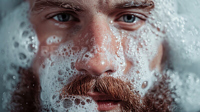 Bubbles, beard and face of man in bath for clean, health and skincare routine with body hygiene. Foam, portrait and male person with facial hair washing in water for wellness treatment at home.