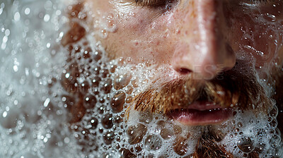 Bubbles, beard and man in bath for clean, health and skincare routine with body hygiene. Foam, mouth and closeup of male person with facial hair washing in water for wellness treatment at home.