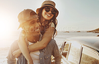 Buy stock photo Couple, sunset and piggy back at beach with care, smile and road trip for holiday adventure in summer. Man, woman and happy with connection, travel and love for bonding in sunshine by ocean in Spain