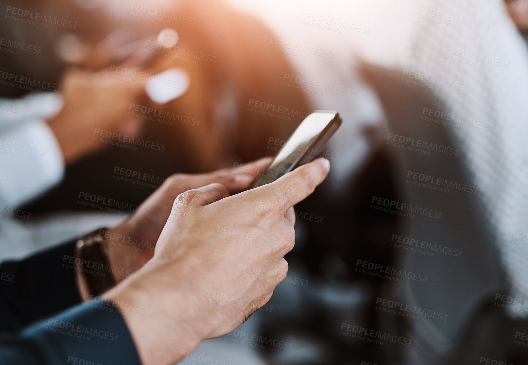 Buy stock photo Cropped shot of a group of businesspeople using their mobile phones during a conference
