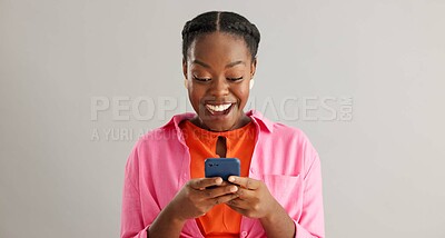 Buy stock photo Face, smile or excited black woman with phone in studio for online, competition or giveaway on grey background. Yes, smartphone or female model portrait with app alert of sign up, winner or prize