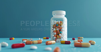 Healthcare, pills and container in studio, color and supplement for vitamins, iron and antibiotic. Blue background, table and treatment with capsules, prescription and medicine for wellness or health