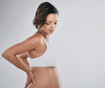 Buy stock photo Woman, pregnant and growth in studio with thinking for child wellness, mama with hope for future. Female person, planning and white background with space for pregnancy, baby health or wellbeing