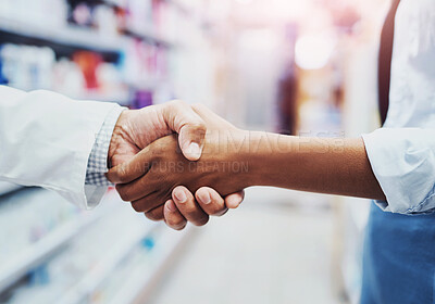 Buy stock photo Closeup shot of an unrecognizable pharmacist shaking hands with a customer in a chemist