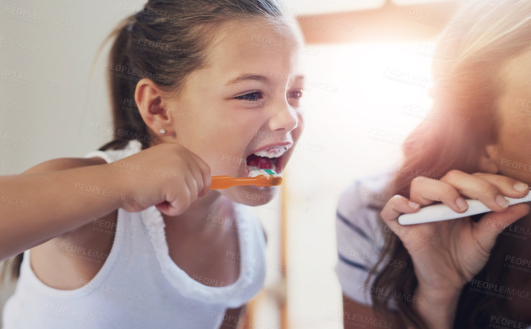 Buy stock photo Girl, brushing teeth and mother with morning routine in home for oral care, hygiene and wellness. Female person, woman and toothbrush for dental health, growth and development in bonding with parent