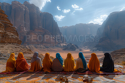 Muslim, group and women praying outdoor for faith, religion and solidarity with Islam by mountains. Back of people on floor with worship of god and Allah for holy and spiritual travel or pilgrim