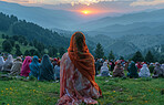 Indian, group and women praying outdoor for faith, religion and solidarity with sunrise on mountains. Back of people on floor with worship of god and heaven for holy and spiritual travel or pilgrim