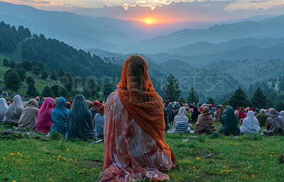 Indian, group and women praying outdoor for faith, religion and solidarity with sunrise on mountains. Back of people on floor with worship of god and heaven for holy and spiritual travel or pilgrim