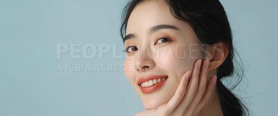 Buy stock photo Beauty, smile and space with portrait of asian woman in studio isolated on blue background. Face, skincare and wellness with happy or natural young model at spa for cosmetics or dermatology on mockup