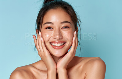 Buy stock photo Asian, woman and portrait for beauty, happy with skincare glow and change with dermatology on blue background. Healthy skin, antiaging treatment or facial with cosmetics, natural and hands on face