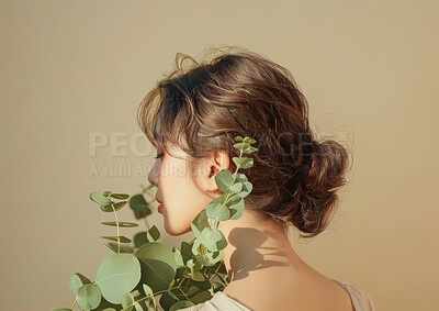 Buy stock photo Beauty, hair and plant with back of woman in studio isolated on gray background for growth or sustainability. Green, skincare and spring with confident young model holding flora for conservation