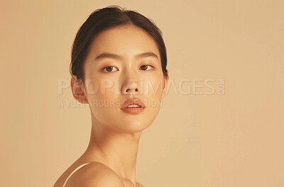 Beauty, makeup and portrait of asian woman on space in studio isolated on cream background. Face, mockup and skincare with confident or natural young model at spa for cosmetics or dermatology