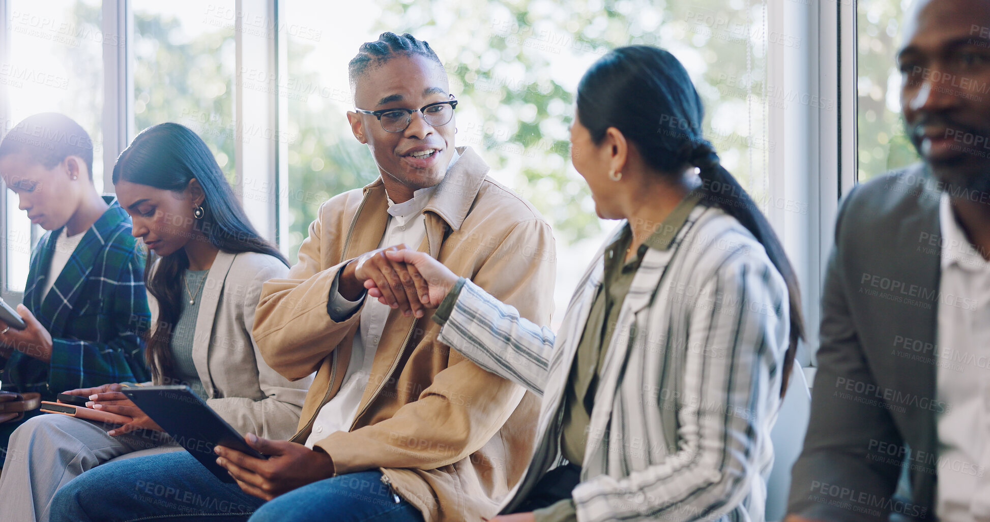 Buy stock photo Networking, tablet and business people with a handshake at a seminar, meeting and discussion. Smile, office and employees shaking hands with technology and speaking while waiting for an interview