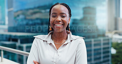 Black woman, face and arms crossed, lawyer happy with career and confident on rooftop, skyscraper and pride. Expert, legal employee or attorney with smile in portrait for corporate and professional