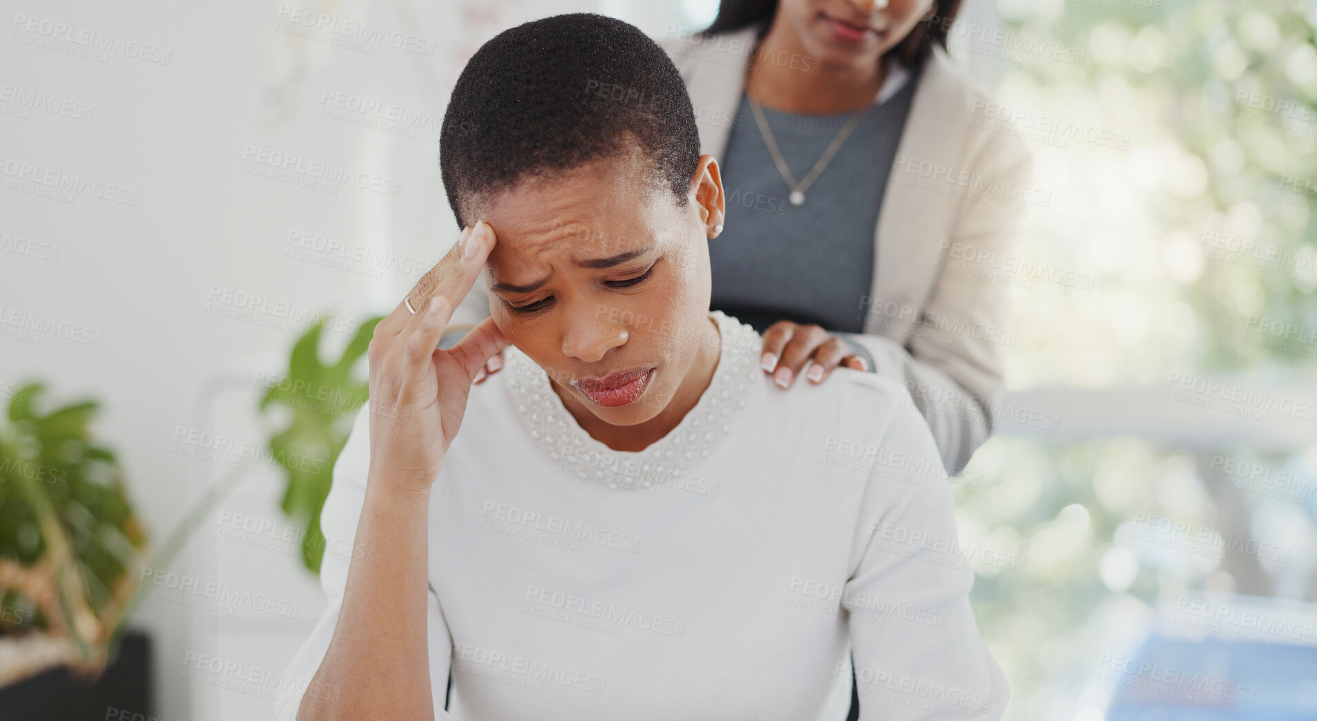 Buy stock photo Empathy, anxiety and friends with black woman in office for stress, pain and support. Burnout, mental health and tired with female employee and migraine in agency for frustrated, sad and fatigue