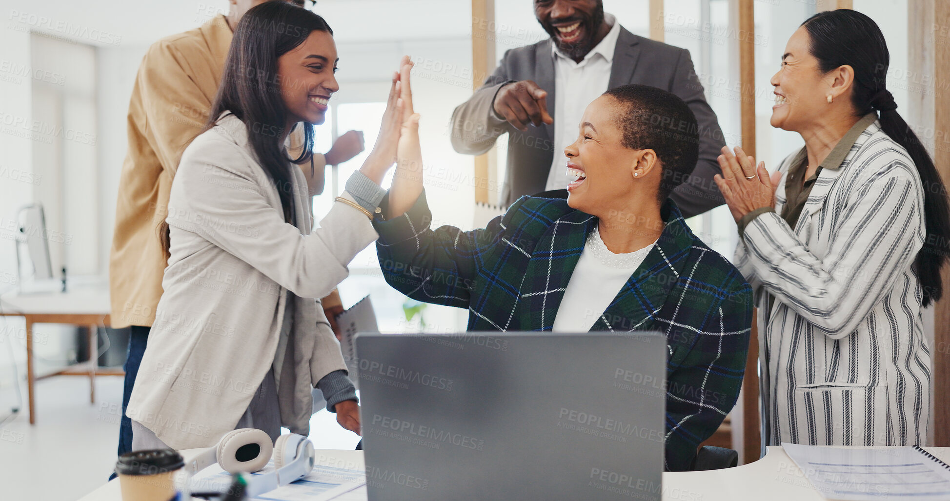 Buy stock photo Success, applause and a black woman with employees and a laptop, high five and celebration of achievement. Win, excited and an African worker with an online promotion, goal or support from team