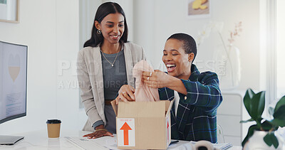 Friends, online shopping and box with a package of clothes, delivery and cardboard parcel from courier, shipping and girl with surprise. Order, clothing and customer unpacking ecommerce in home