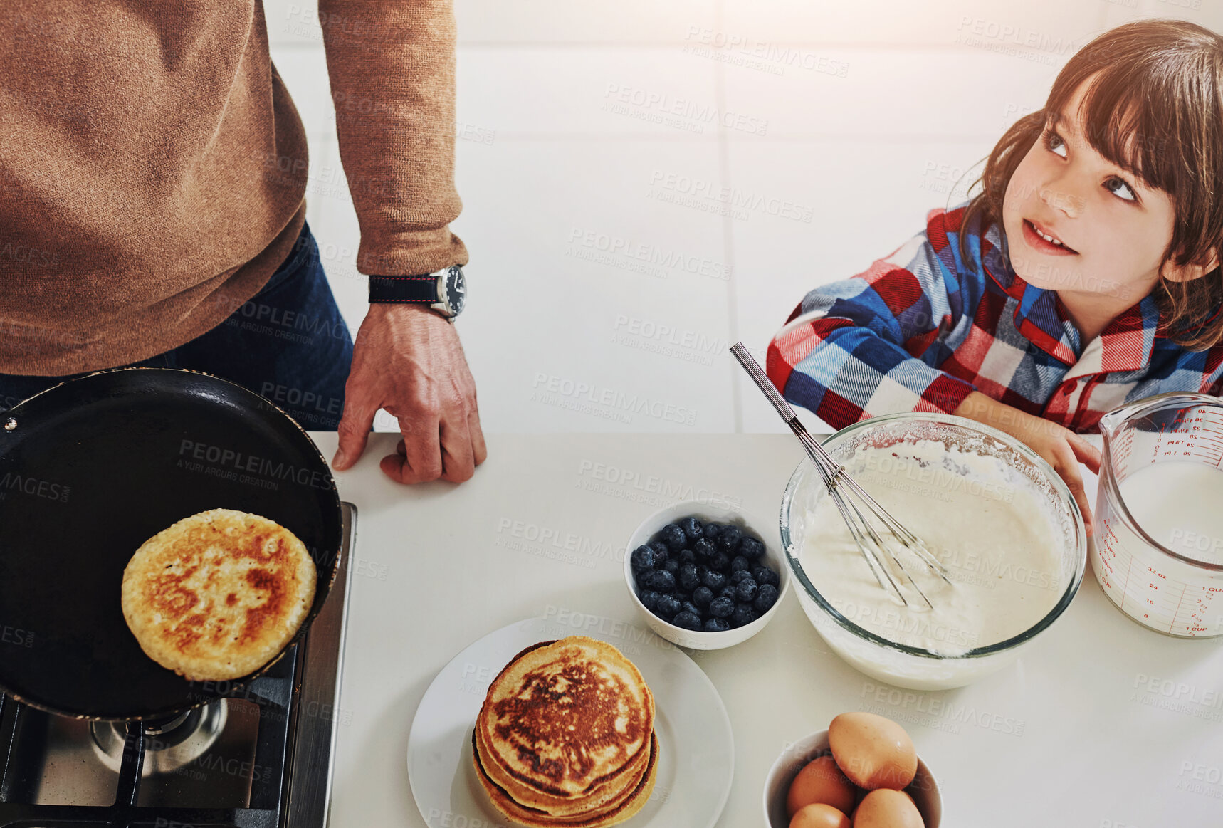 Buy stock photo Breakfast, cooking pancakes and boy in kitchen with parent from above for diet, health or nutrition. Family, food and recipe for ingredients with son in apartment for morning meal preparation