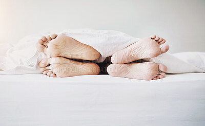 Buy stock photo Feet, couple and bed in a home at morning with sleeping, rest and nap of people in bedroom. Legs, together and linen sheet with fight and face away from partner after divorce problem and issue