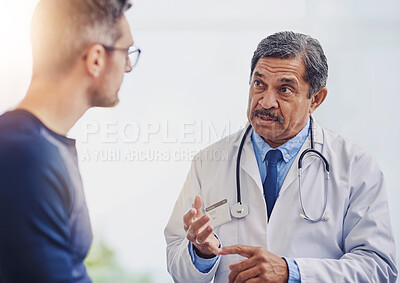 Buy stock photo Man, doctor and consulting with patient for health advice, medical assurance or dosage at hospital. Mature, male person or healthcare professional talking or explaining clinic instructions for client