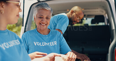 Volunteer, donation and people with food package for charity event, teamwork and community programme. Collaboration, volunteering and men and women with van for parcel, bags and grocery distribution