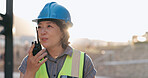 Woman, construction and inspection with radio for communication, Japanese supervisor and lens flare. Check building site, walkie talkie and engineer in Japan, architecture and project management