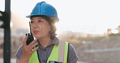 Woman, construction and inspection with radio for communication, Japanese supervisor and lens flare. Check building site, walkie talkie and engineer in Japan, architecture and project management