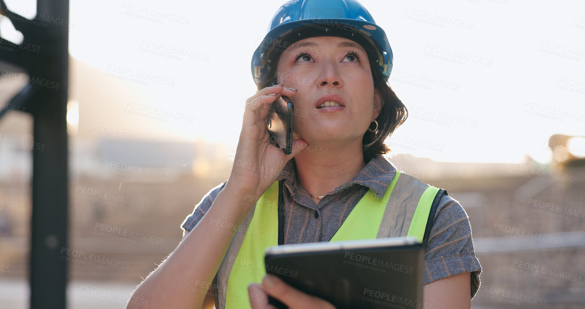 Buy stock photo Asian woman, phone call and tablet, construction worker and inspection of building site for project management. Architecture, engineer and communication, contractor and affirmative action outdoor