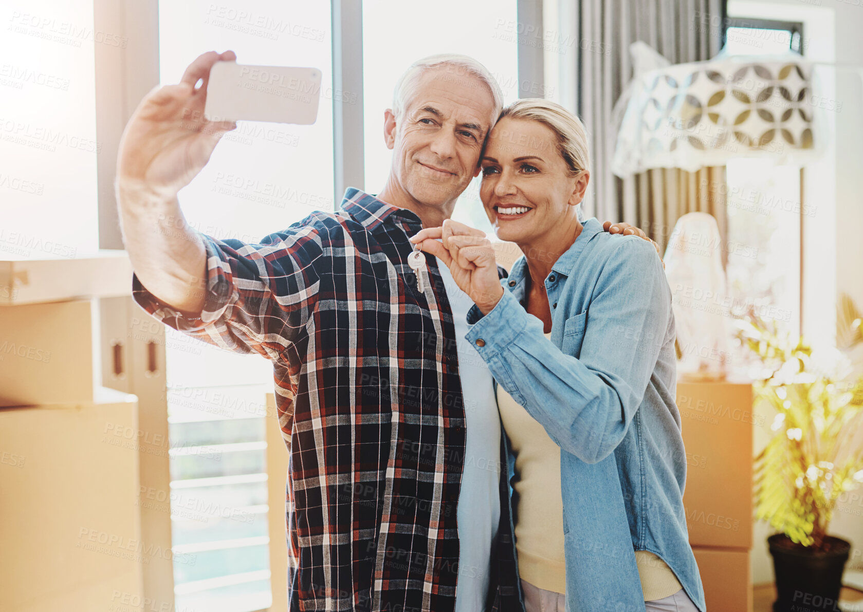 Buy stock photo Moving, selfie and senior couple with box in house for real estate, property ownership and memory. Love, man and woman in digital photography with home relocation, update and packing for immigration