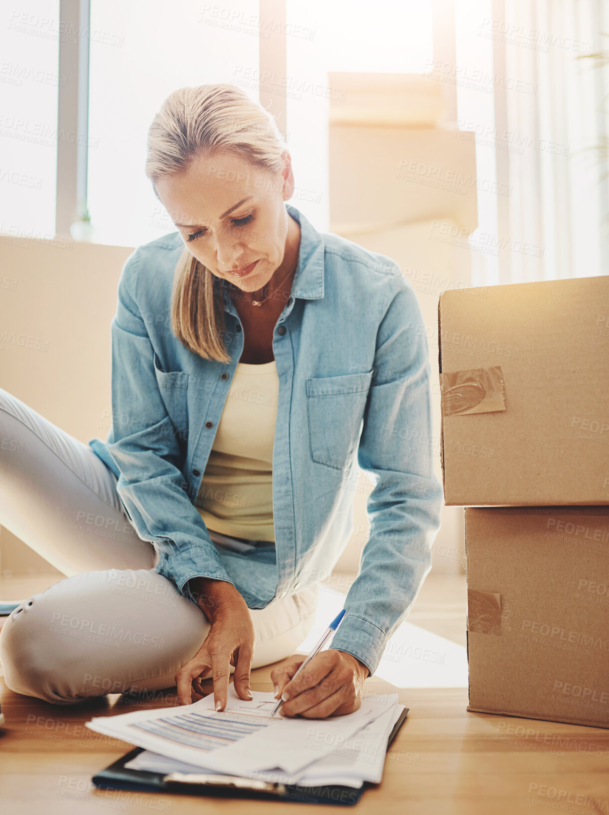 Buy stock photo Paperwork, boxes and woman on the floor in apartment for growth on investment in mortgage. New house, document and sign for lease agreement for home insurance in title and for savings and finance.