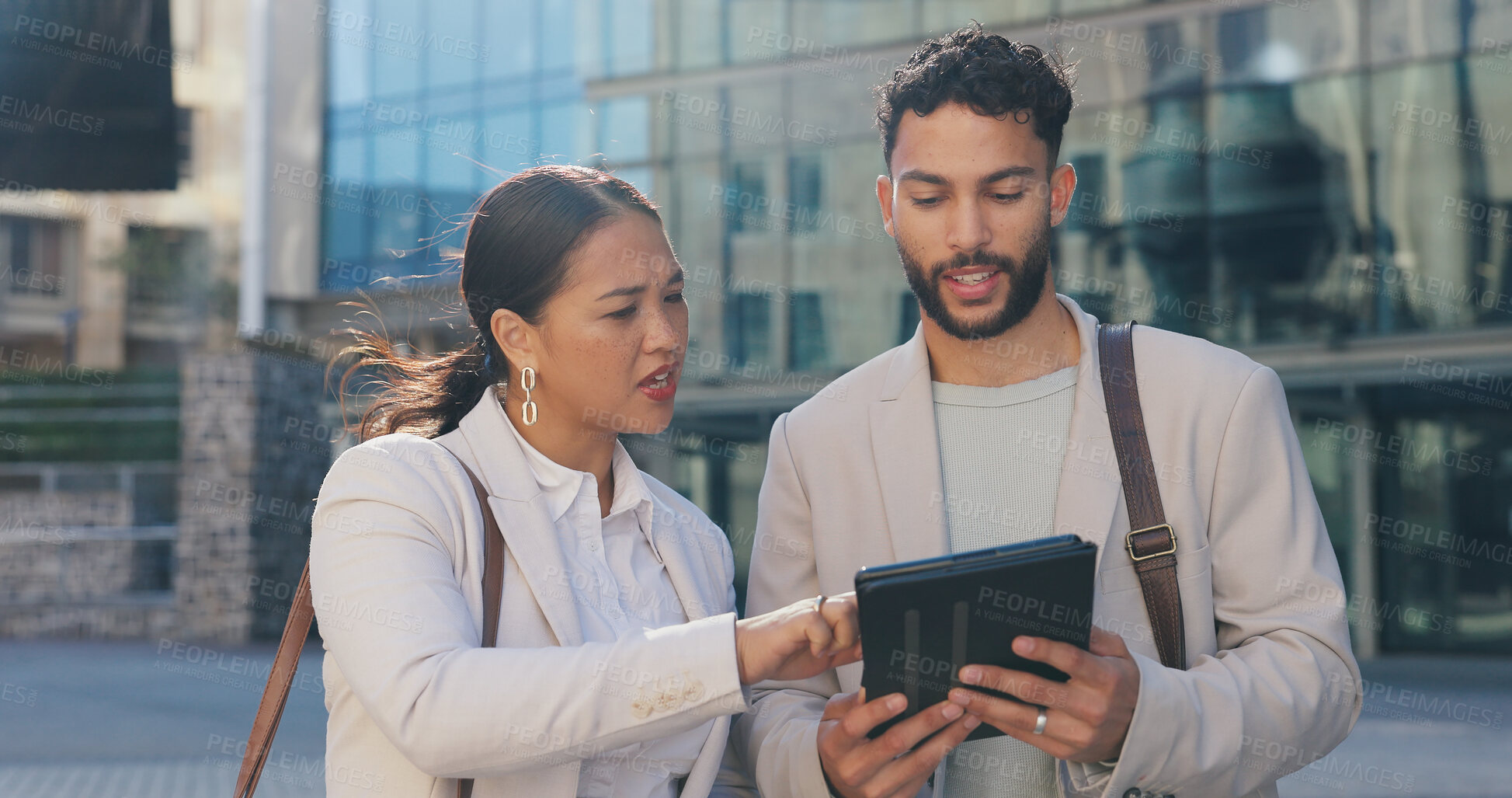 Buy stock photo Business people, walking and talking with tablet in city for research, browsing or outdoor networking. Businessman and woman in project discussion, idea or online tasks on technology in an urban town