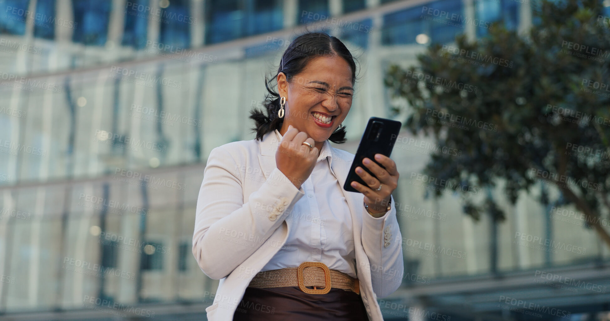 Buy stock photo Business, phone and happy woman with winner fist celebration in a city with news, success or results. Yes, hands and excited investor with investment growth alert, email or competition prize in Tokyo