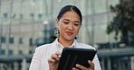 Asian woman, business and thinking with tablet in city for vision, career ambition or future outside building. Female person or employee with smile in wonder for decision on technology in urban town