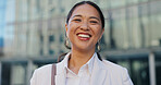 Japanese business woman, face and city with smile, confidence and pride for career by office buildings. Person, corporate employee and outdoor on metro street for commute, travel and happy in Tokyo