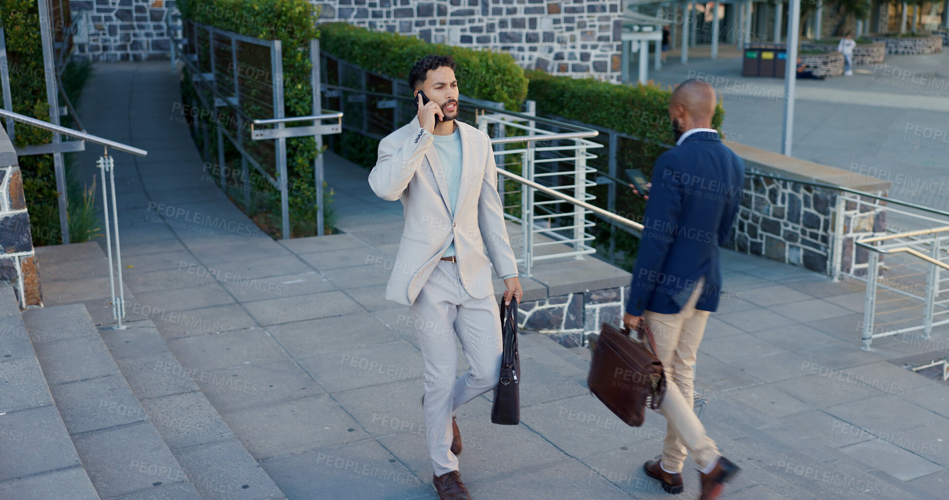 Buy stock photo Business men, phone call and talking in city on commute to work in metro with discussion, chat and walking. People, staff and employees with digital touchscreen, bag or advice with travel on sidewalk