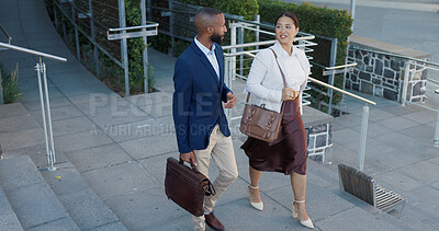 Business man, woman and talking in street on commute to work in metro with discussion, chat and walking. People, staff and employees with bag, outdoor and conversation for travel on metro sidewalk