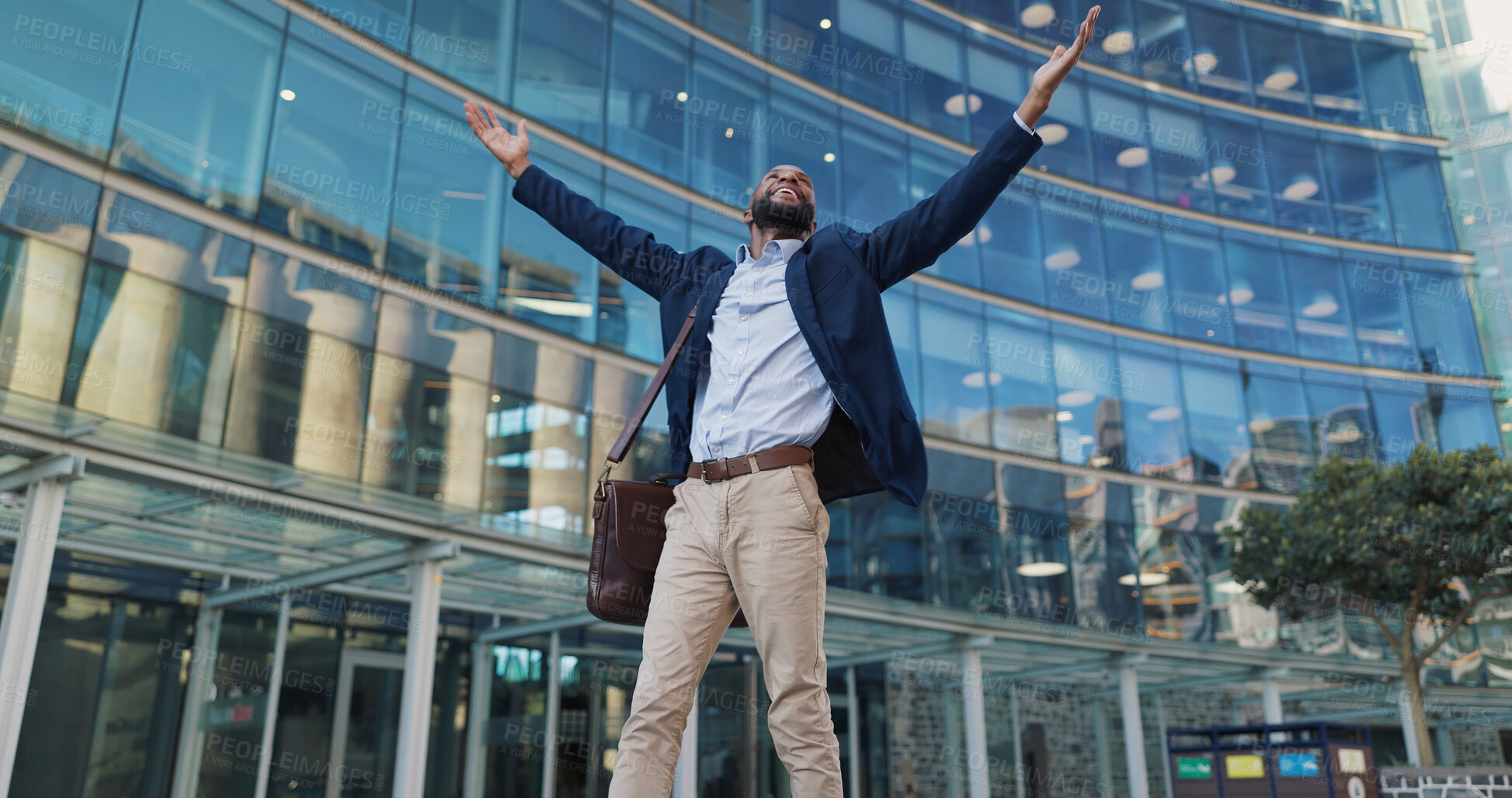 Buy stock photo Business man, freedom and excited in city for travel, opportunity and celebration outdoor. Professional African winner, lawyer or worker by urban building with wow, hands and arms up for gratitude