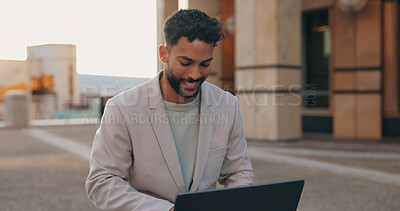 Business man, laptop and typing in street for ideas, writing or report for remote work in metro, sidewalk or city. Person, computer and happy in freelance job with reading for creativity media agency