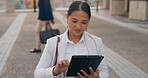 Asian woman, business and browsing with tablet in city for research, social media or outdoor networking. Female person or employee with smile on technology for online search, web or internet in town