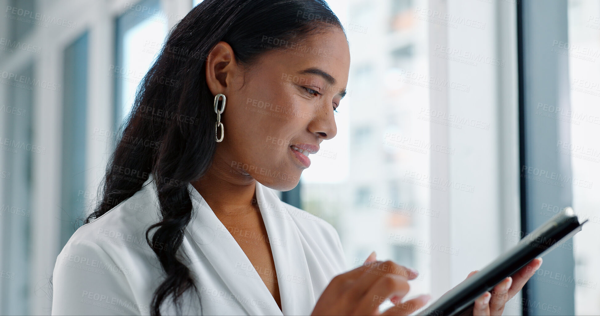 Buy stock photo Business woman, tablet and reading in hallway at modern office with communication, vision and networking. Person, touchscreen and typing with thinking, application and problem solving in workplace