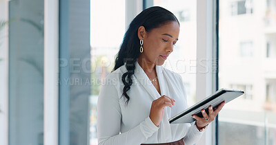 Business woman, tablet and reading in hallway at modern office with communication, vision and networking. Person, touchscreen and typing with thinking, application and problem solving in workplace