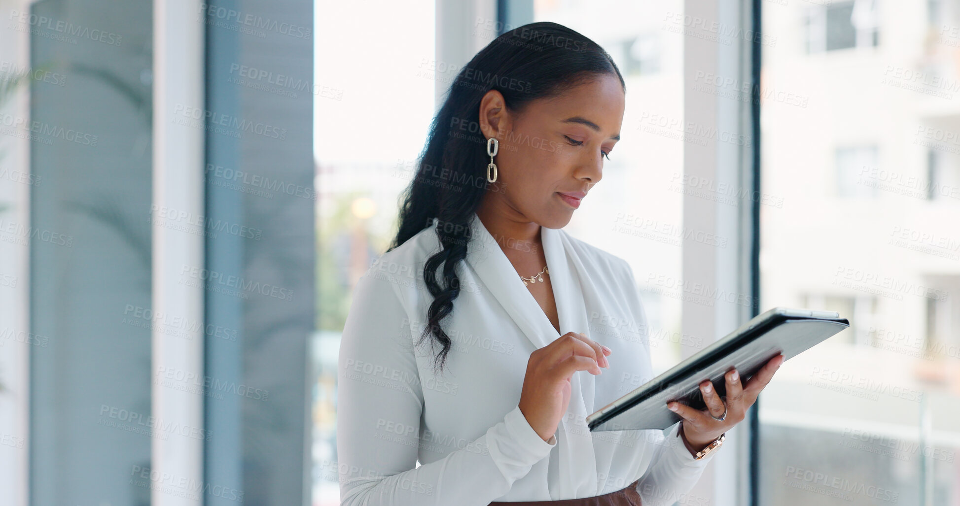 Buy stock photo Business woman, tablet and reading in hallway at modern office with communication, vision and networking. Person, touchscreen and typing with thinking, application and problem solving in workplace