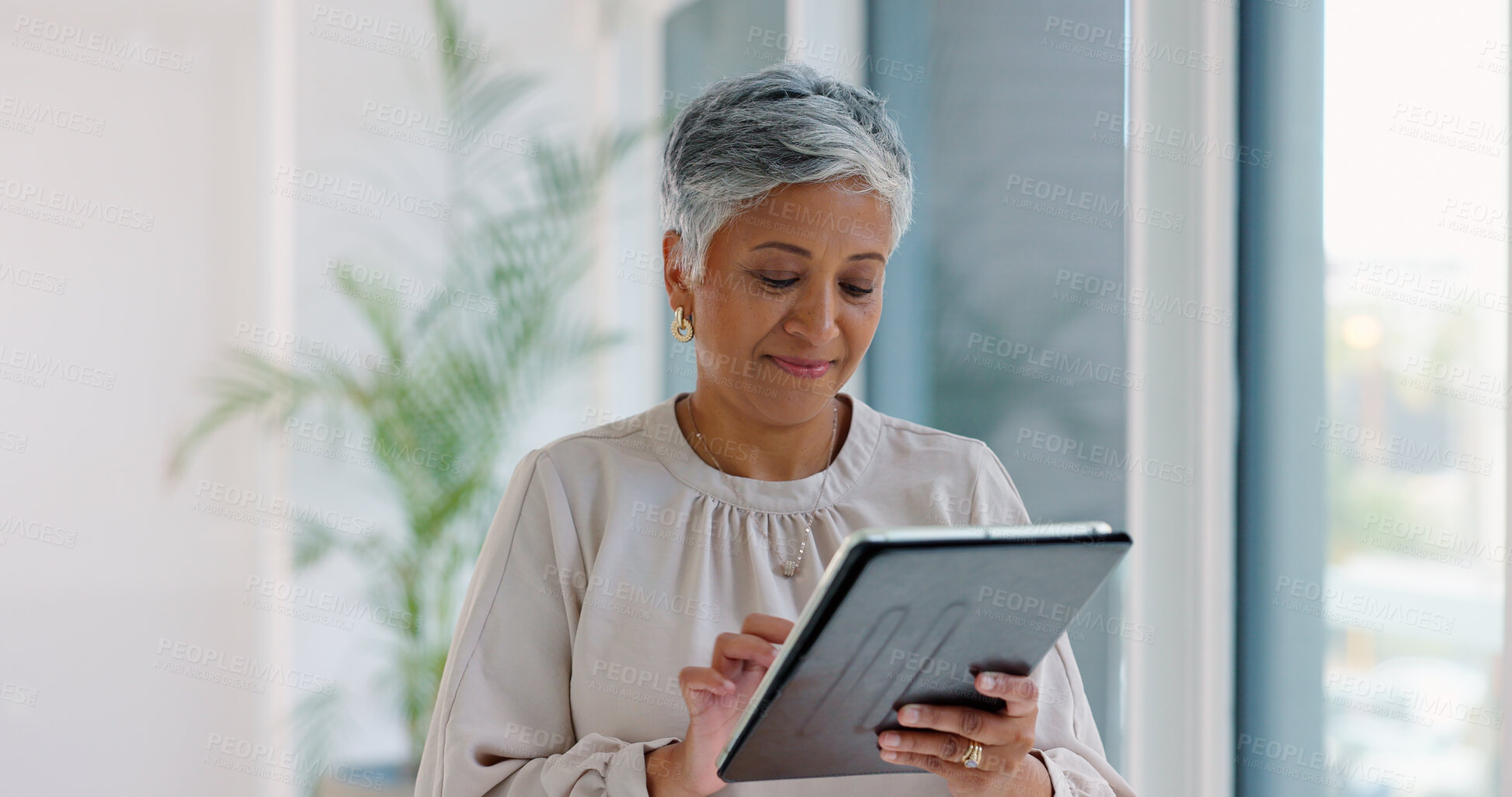 Buy stock photo Business woman, tablet and typing in hallway at modern office with communication, vision and networking. Person, touchscreen and reading with thinking, application and problem solving in workplace